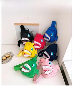 Detail view of colorful cartoon shark chest bags for kids in seven vibrant canvas colors