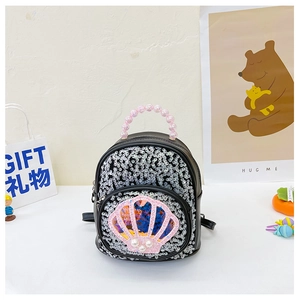 Detail of sequined toddler backpack with pink pearl handle and glittery shell patch