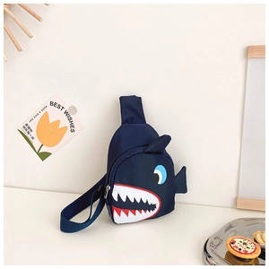 Detail of cute shark-shaped navy blue canvas crossbody bag for kids with fin decoration