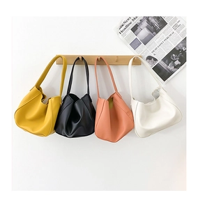 Selection of trendy mini crossbody dumplings bags in mustard, pink, cream, and black