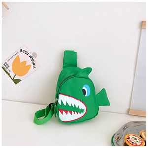 Detail of green shark cartoon chest bag for kids with adjustable strap and canvas texture