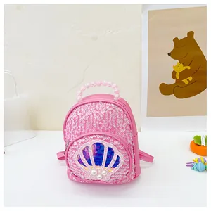 Detail of pink sequin toddler backpack with shell patch and pearl bead handle