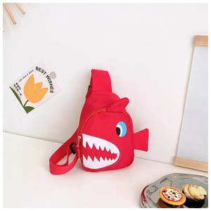 Detail of red shark-shaped canvas sling bag for kids with adjustable black strap