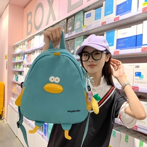 Cute green duck-shaped backpack with 3D eyes and feet for school and casual travel