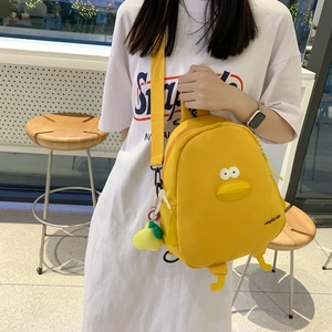 Cute bright yellow cartoon duck backpack with plush charm and 3D beak details