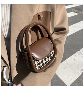 Street style shot of a mini brown leather tote with houndstooth panel for women and kids