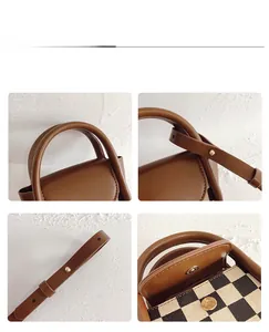 Detail view of mini checkered tote bag with brown leather handles and gold metal hardware