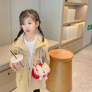 Girl's red leather handbag with white lace bow, pearl handle, and gold chain strap