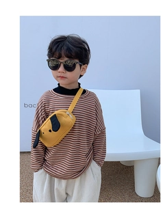 Close-up of yellow canvas puppy chest bag for kids with adjustable strap and zip detail