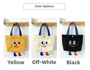 Detailed view of canvas tote bags with cartoon faces and cute 3D feet in three colors