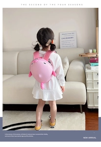 Pink cartoon shark shell backpack for kids featuring padded straps and durable shell