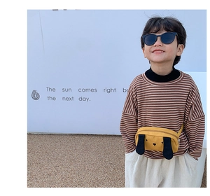 Kids yellow cartoon dog chest bag showing outdoor wear style and cute canvas design