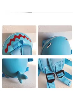 Close-up of shark backpack details showing red wavy lines and blue fin decoration