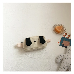 Detailed close-up of cute cartoon dog canvas waist bag for kids with adjustable strap