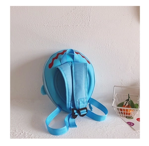 Detail view of the breathable mesh padding and adjustable straps on the light blue shark backpack