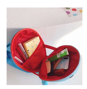 Internal view showing red lining and mesh compartment of the shark hardshell backpack