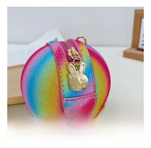 Close-up of rainbow glitter basketball bag with gold rabbit zipper and metal chain