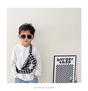 Close-up of kids colorful checkerboard chest bag with Born Champ strap and sporty design