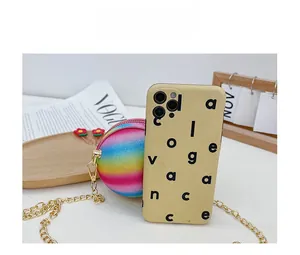 Detailed comparison of rainbow sequin ball bag with smartphone showing mini size