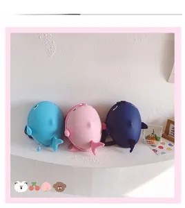 Detailed view of shark backpack in blue, navy, and pink colors on white display