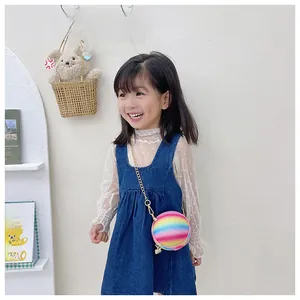 Detail of glittery rainbow basketball bag for kids with golden metal chain strap
