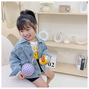 Detail of a purple checkered round crossbody bag for kids with a sleek gold chain strap