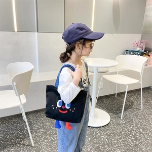 Kids funny face canvas handbag with 3D plush legs and cute cartoon facial print design