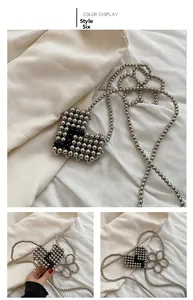 Detail of Style 6 handmade beaded heart mini bag with silver and black metallic beads