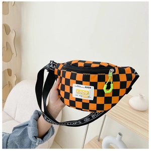 Detail of checkered orange and black waist bag with stylish ADDR tag and neon puller