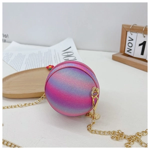 Detailed macro view of colorful gradient round bag with gold chain strap and floral charm