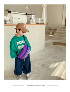 Close-up of stylish purple canvas waist bag for kids featuring a street style design