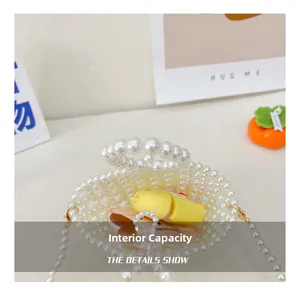 Detail showing the internal storage capacity of the handmade white beaded mini bag