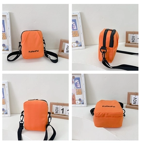 Detailed views of orange nylon mini crossbody bag with black zipper and adjustable strap