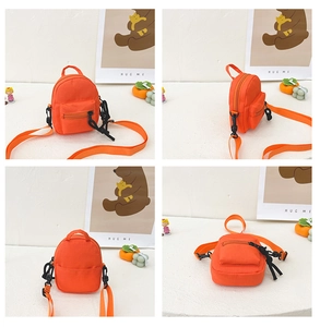 Detailed views of an orange mini nylon backpack with detachable straps and a front pocket