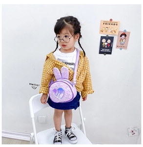 Detail of purple sequin kids crossbody bag with 3D bunny ears and holographic heart patch