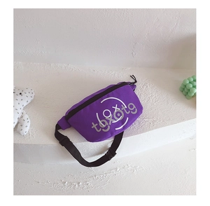 Close-up of boys purple canvas chest bag with adjustable black strap and smile graphic
