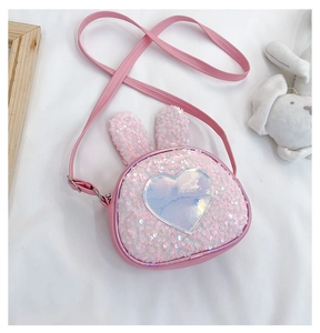 Detailed view of pink sequin rabbit bag with holographic heart for kids