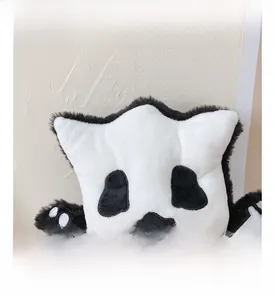 Detail of cute panda backpack showing plush fabric texture and soft embroidered facial features