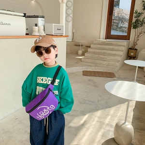 Fashionable purple canvas waist bag for boys featuring white typography in a cafe setting
