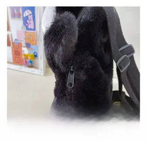 Detail showing premium black plush fabric and sturdy metal zipper on this cute backpack