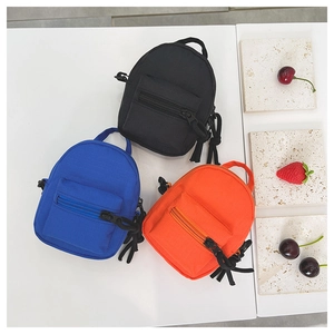 Mini canvas coin purses in black, blue and orange colors with zipper details