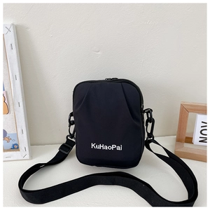 Close-up of a black canvas crossbody bag with KuHaoPai lettering and adjustable strap