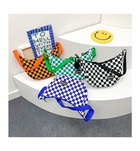 Checkerboard crossbody bags in four colors displayed on stairs with adjustable straps