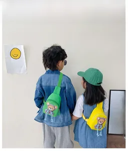 Detailed back view of kids cartoon bear canvas chest bag with adjustable straps