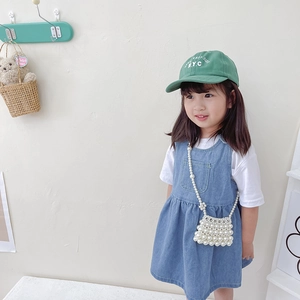 Handmade pearl beaded floral crossbody bag for girls with denim dress and NYC baseball cap