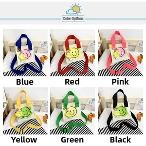 Close-up of smiley face canvas bags for kids in six vibrant colors and floral charms
