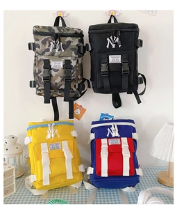 Detail of multi-color nylon backpacks featuring NY embroidery and durable buckles
