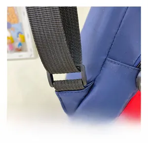Close-up of adjustable strap buckle and nylon stitching on kids crossbody chest bag