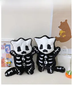 Detail of cute plush Halloween cat skeletons with black and white bone pattern design