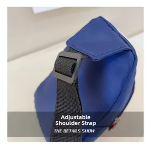 Detail shot of the adjustable black nylon shoulder strap on the blue kids chest bag